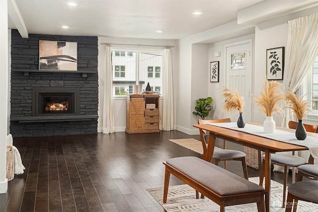 dining space featuring dark wood finished floors, recessed lighting, a fireplace, and baseboards