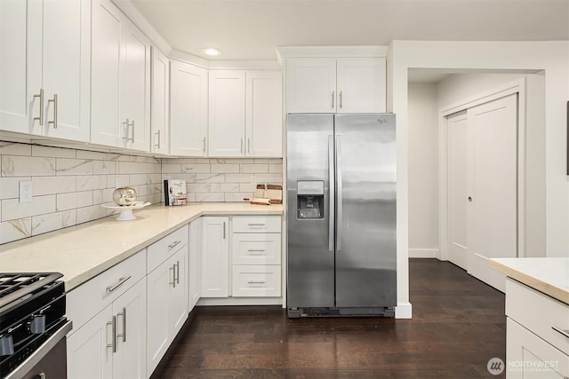 kitchen featuring white cabinetry, dark wood-style floors, stainless steel fridge with ice dispenser, and light countertops