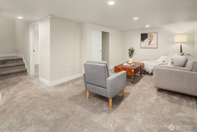 carpeted living room with recessed lighting, stairs, and baseboards