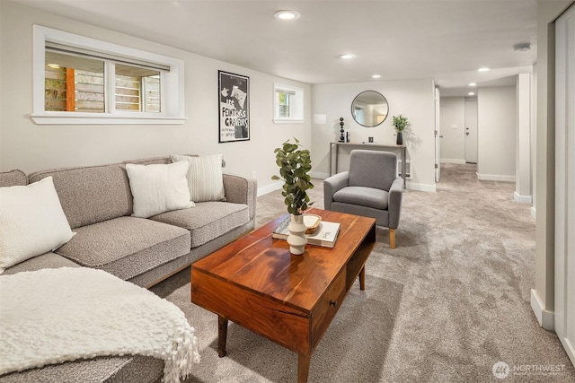 carpeted living area featuring recessed lighting and baseboards