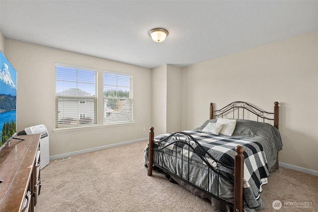 bedroom featuring light carpet, visible vents, and baseboards