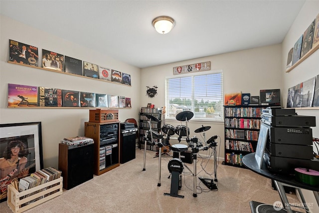 carpeted home office with a fireplace