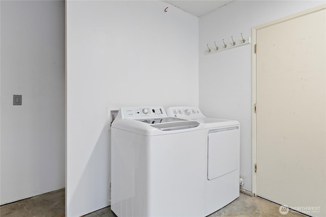 washroom featuring laundry area and separate washer and dryer