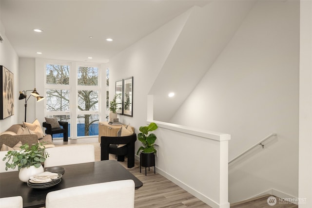 dining space featuring recessed lighting, light wood-type flooring, and baseboards