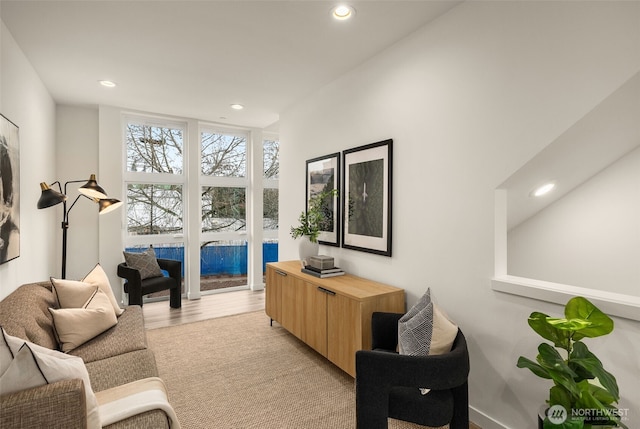 living area featuring recessed lighting and light wood-style flooring