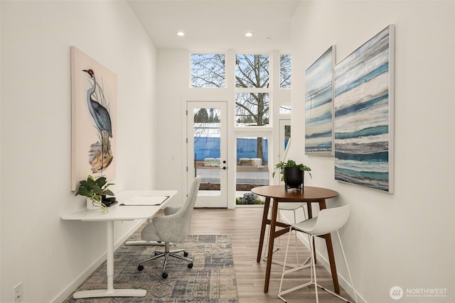 home office featuring recessed lighting, french doors, baseboards, and wood finished floors