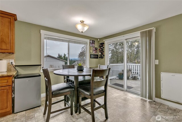 dining area with a wealth of natural light and baseboards