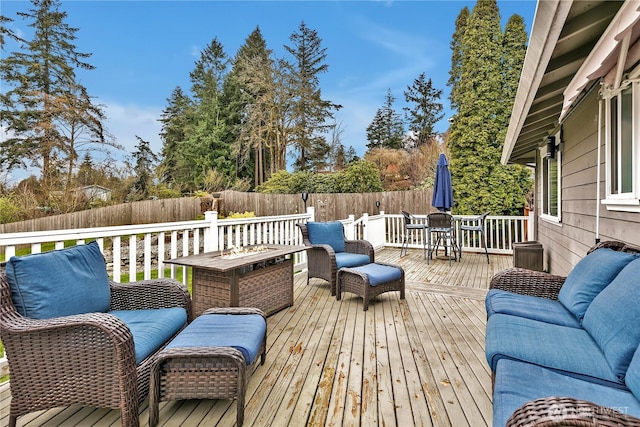 wooden deck featuring an outdoor hangout area, outdoor dining space, and fence