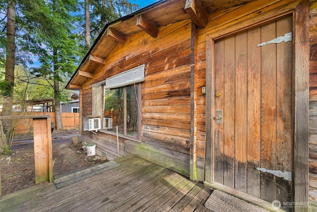 wooden terrace featuring fence