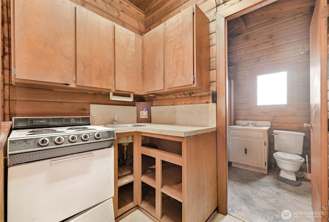 kitchen with light brown cabinetry, a sink, unfinished concrete flooring, white electric range oven, and light countertops