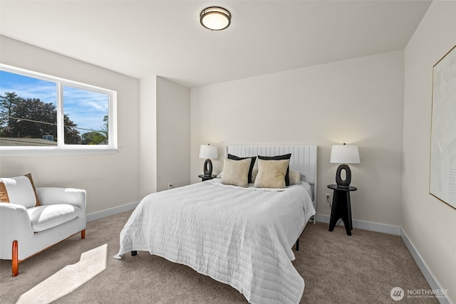 bedroom with carpet flooring and baseboards