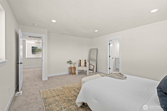 bedroom with recessed lighting, visible vents, light carpet, and baseboards