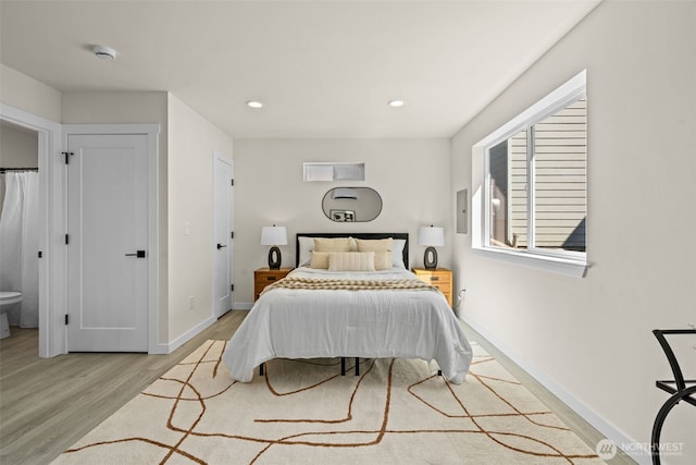 bedroom with recessed lighting, baseboards, and light wood finished floors