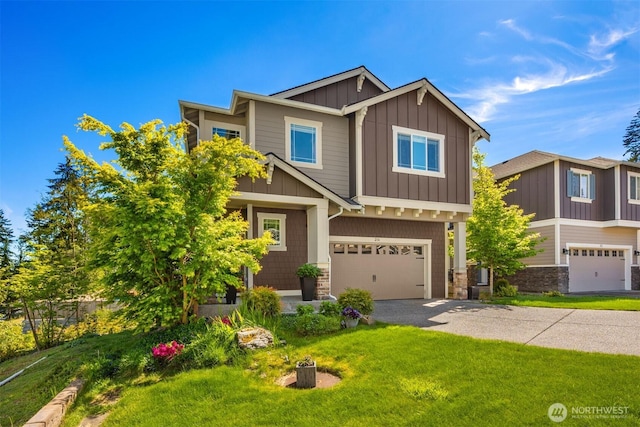 216 178th St SE, Bothell, WA 98012 - craftsman-style house featuring a front yard, board and batten siding, a garage, and stone siding
