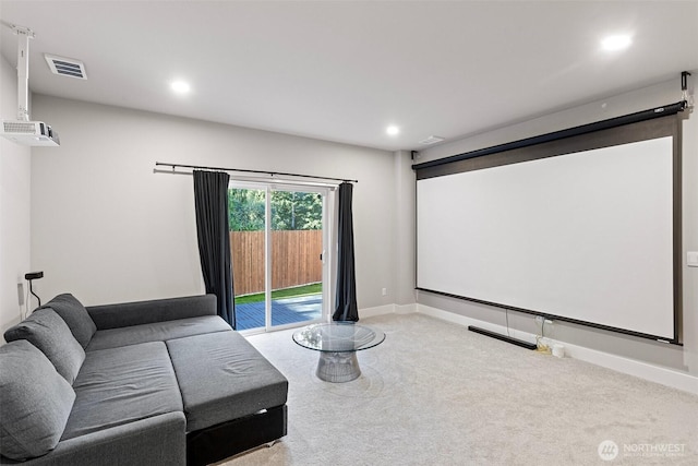 carpeted cinema room with recessed lighting, visible vents, and baseboards