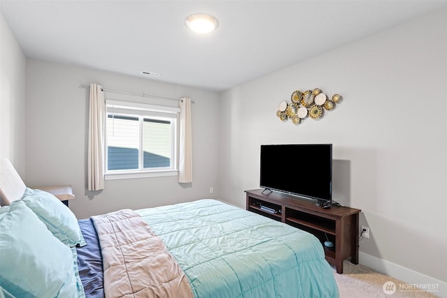 bedroom featuring visible vents, baseboards, and carpet floors