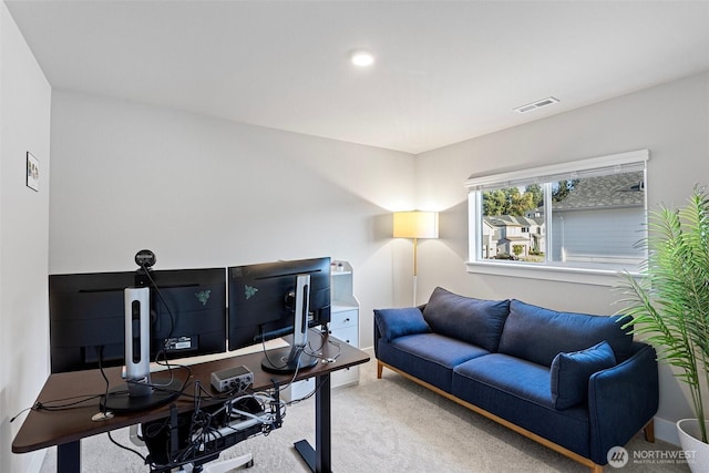 office space with visible vents, carpet flooring, and baseboards