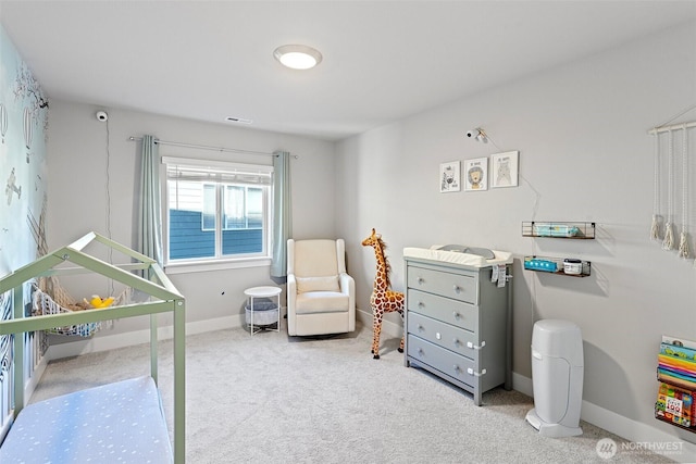 carpeted bedroom with visible vents and baseboards