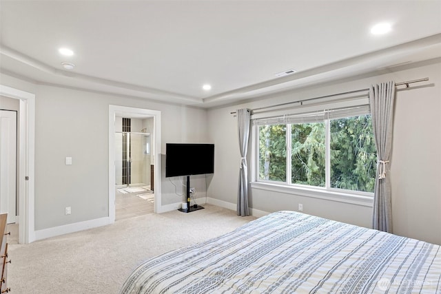 carpeted bedroom with recessed lighting, baseboards, visible vents, and ensuite bathroom