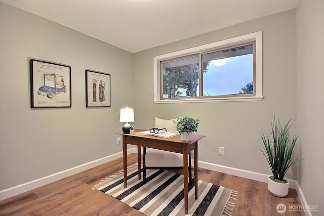 office with wood finished floors and baseboards