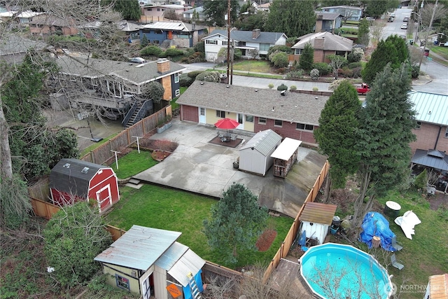 birds eye view of property with a residential view