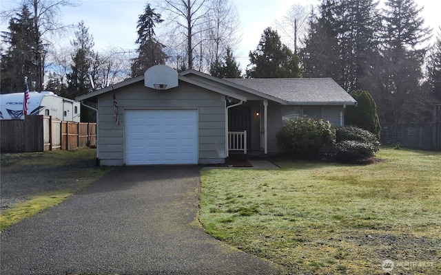 ranch-style home featuring driveway, a front lawn, and fence