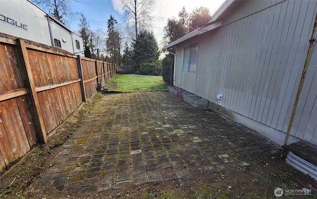 exterior space with a patio area and a fenced backyard