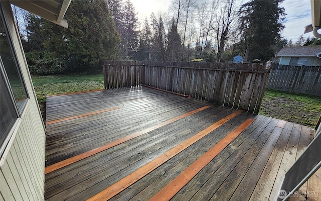 deck with a fenced backyard