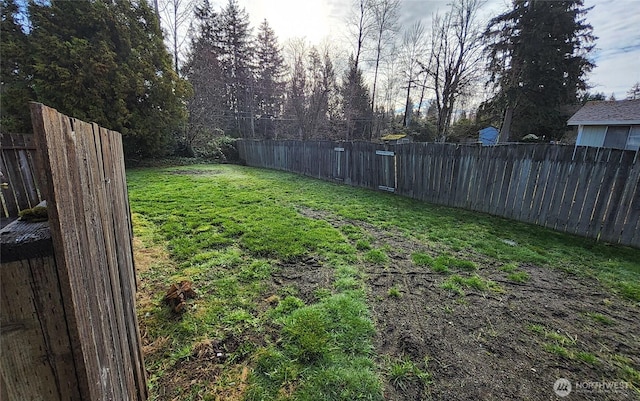 view of yard with a fenced backyard