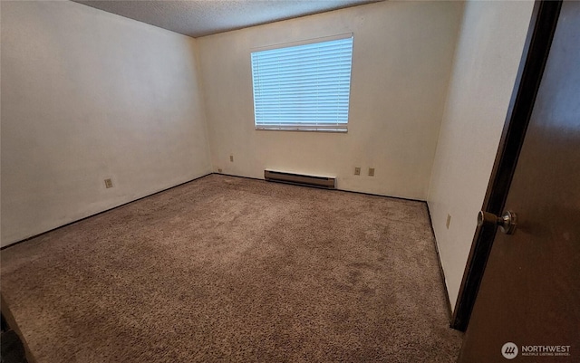 unfurnished room with carpet floors, baseboard heating, and a textured ceiling