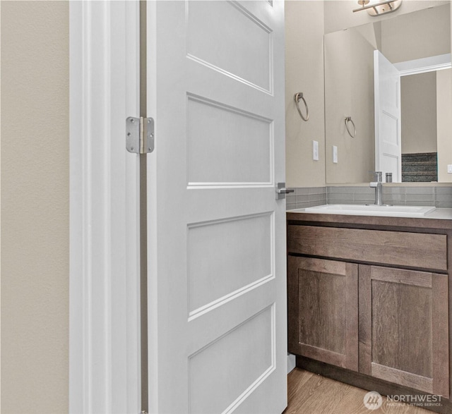 bathroom featuring vanity and wood finished floors