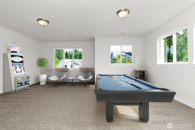 recreation room featuring a wealth of natural light, visible vents, and carpet