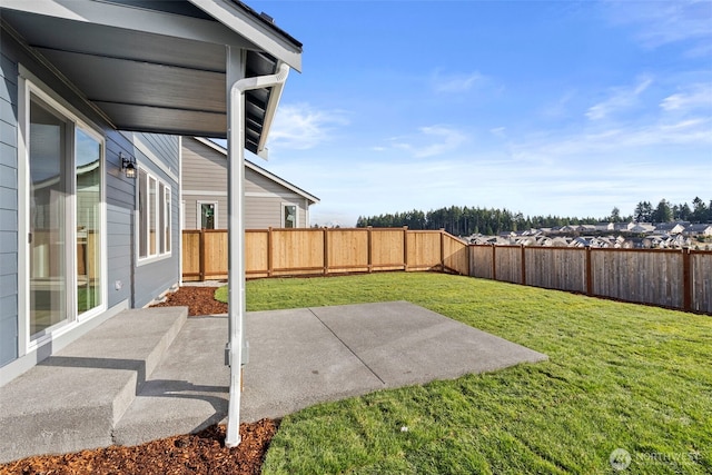 view of yard featuring a fenced backyard and a patio