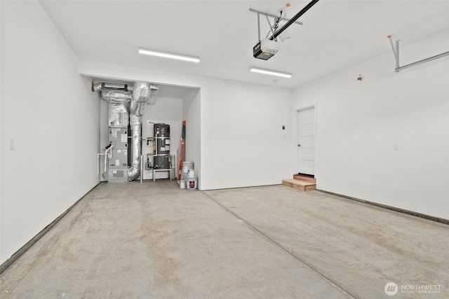 garage featuring heating unit and a garage door opener