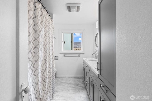 14530 Rutherford Rd, Yakima, WA 98903 - bathroom featuring marble look tiles and vanity