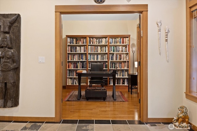 sitting room featuring visible vents and baseboards