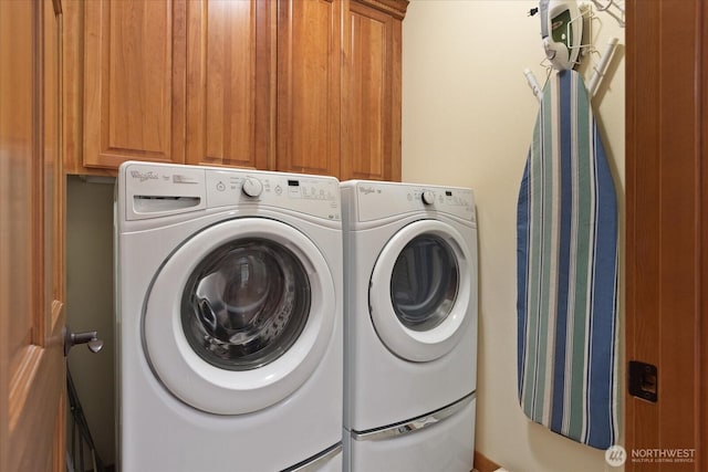 laundry room featuring cabinet space and independent washer and dryer