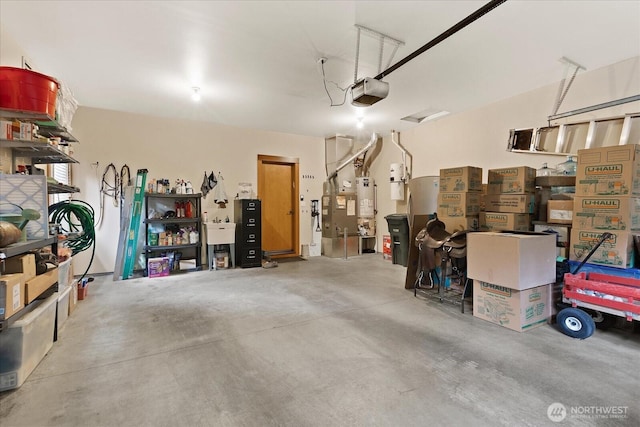 garage with a garage door opener and water heater