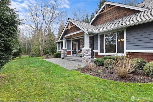 view of home's exterior with a lawn