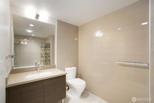 588 Bell St Unit 1603S, Seattle, WA 98121 - full bath featuring toilet, tile walls, a shower with curtain, and vanity