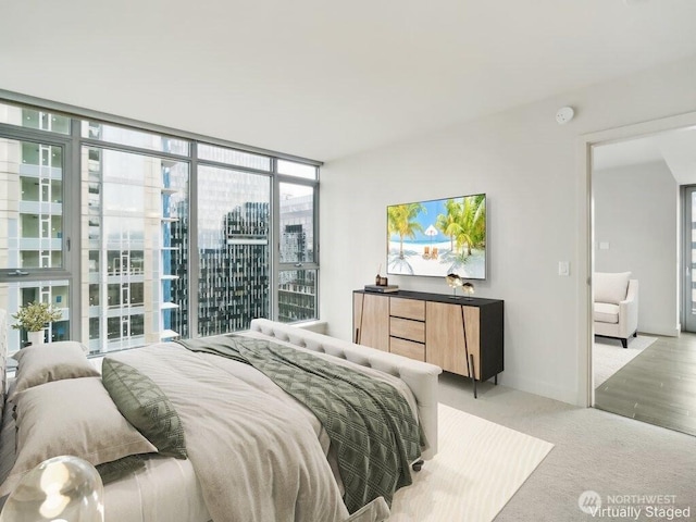 588 Bell St Unit 1603S, Seattle, WA 98121 - bedroom with multiple windows, floor to ceiling windows, and light colored carpet