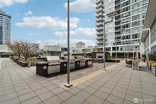 588 Bell St Unit 1603S, Seattle, WA 98121 - view of patio / terrace with exterior kitchen, area for grilling, and a view of city
