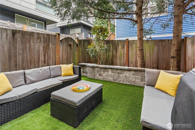 view of patio featuring an outdoor hangout area and a fenced backyard