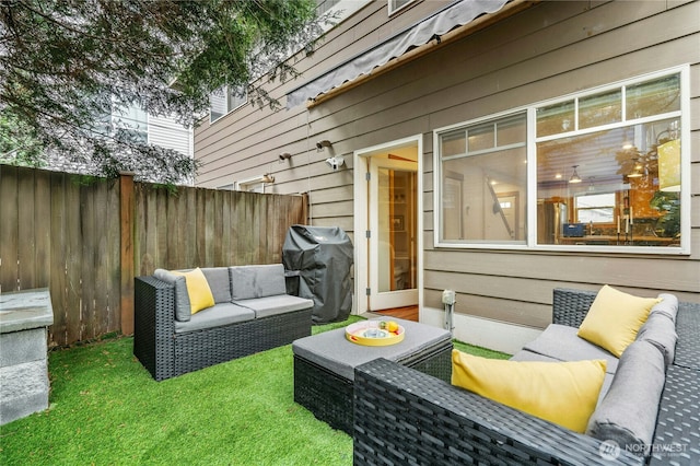 view of patio with grilling area, an outdoor living space, and fence