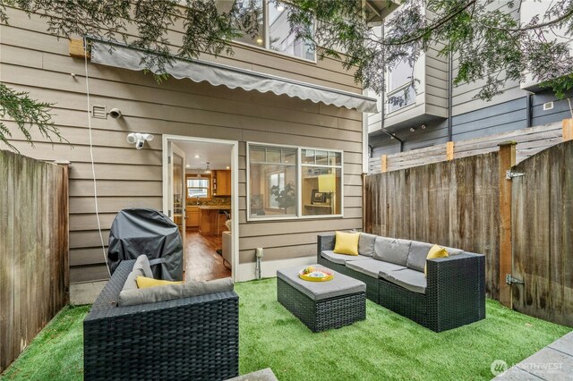 view of patio with area for grilling, an outdoor hangout area, and fence