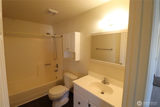 full bath with visible vents, toilet, shower / bath combination, and vanity