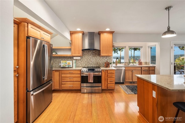 kitchen featuring wall chimney range hood, light wood-type flooring, decorative backsplash, stainless steel appliances, and open shelves