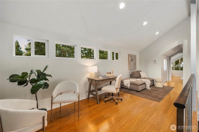 home office featuring recessed lighting, wood finished floors, and vaulted ceiling