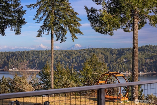 property view of mountains featuring a forest view and a water view