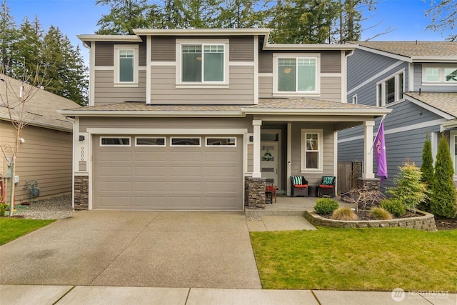 view of front of home with stone siding, driveway, an attached garage, and a shingled roof